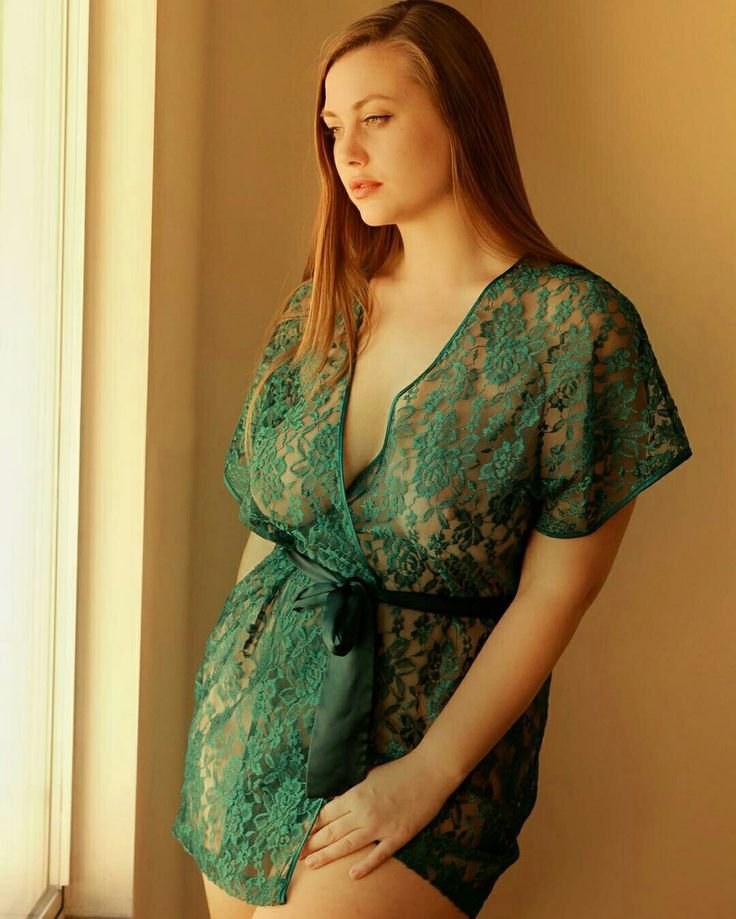 The girl undresses in the forest