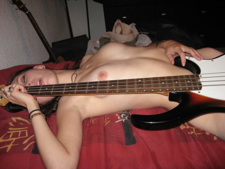 Erotic photo shoot with guitar