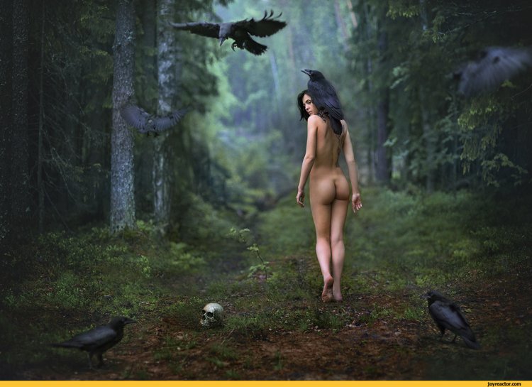 The girl undresses in the forest