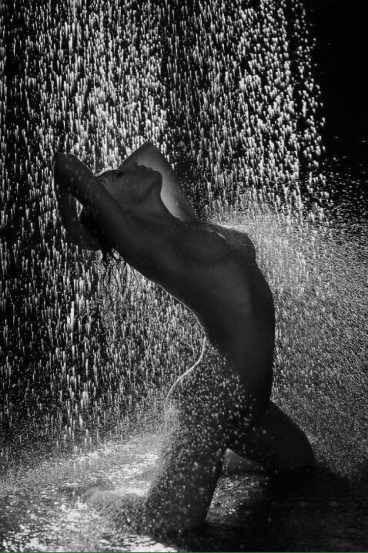 Naked beauties in the rain