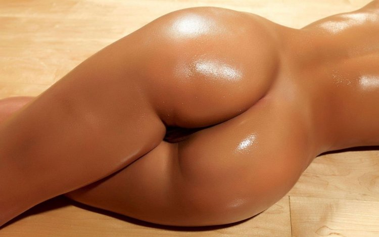 Beautiful female butt in oil