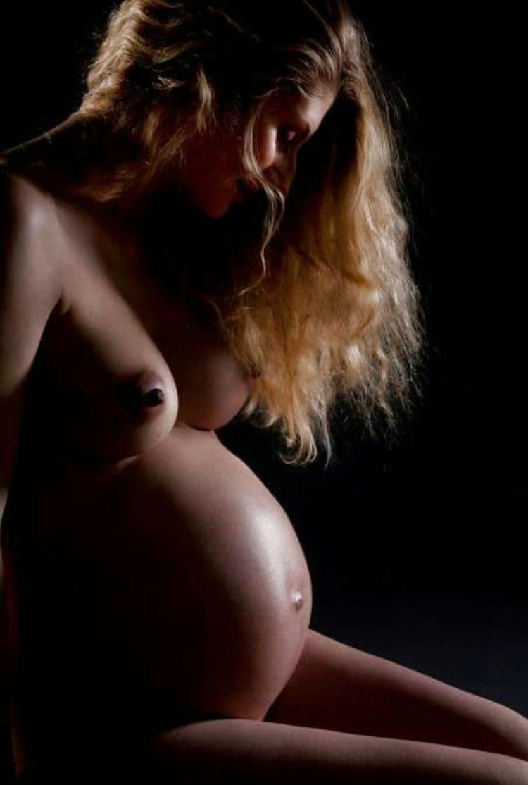 Naked red pregnant woman