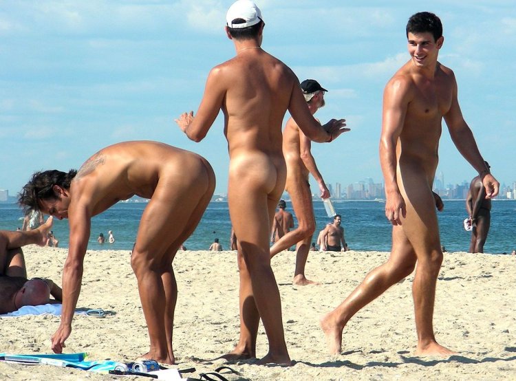 Naked girls with guys on the beach