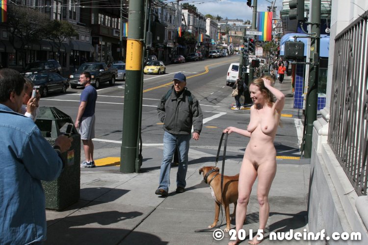 The model undresses on the street