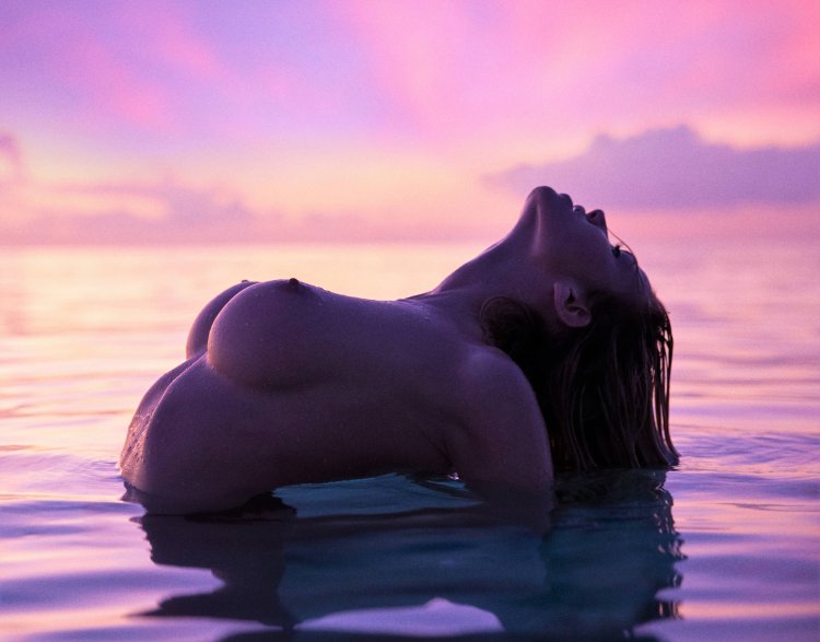 Beautiful girl nude under a boy