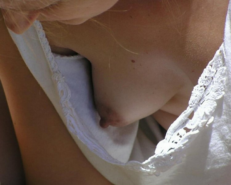 Standing breasts under a blouse