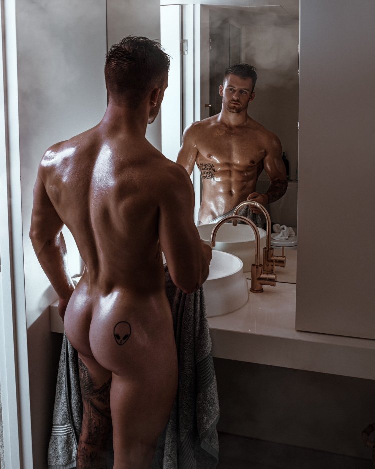 Naked guys in the shower after training