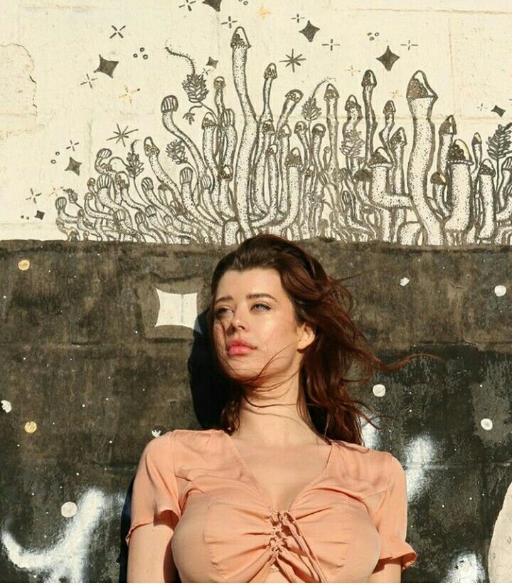 Sarah McDaniel on the background of a carpet