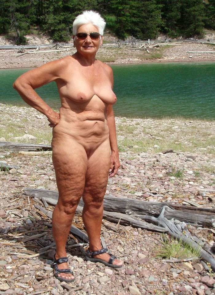 Grandma naked at home on the bed