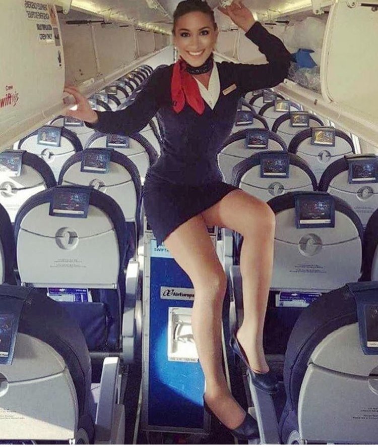 Stewardess Serving table on an airplane