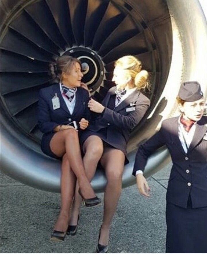 Under the skirt of the stewardess on an airplane