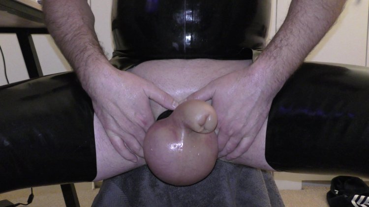 Saline Pumped Huge Cock and Balls on the Beach