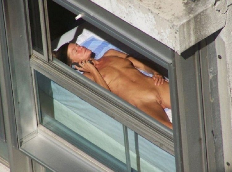 Peeping out the windows behind naked