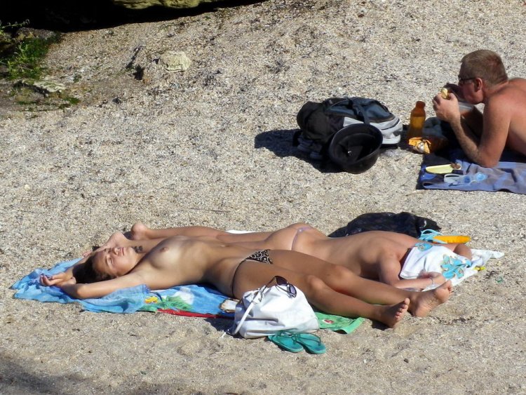 Beautiful breasts on a public beach