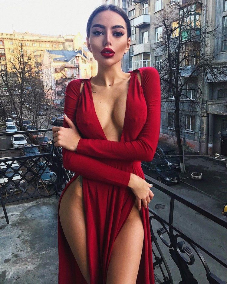 Alena Omovich in a dress