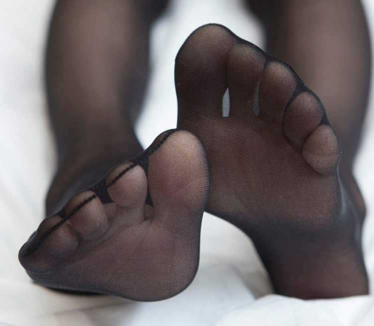 Beautiful female feet in pantyhose