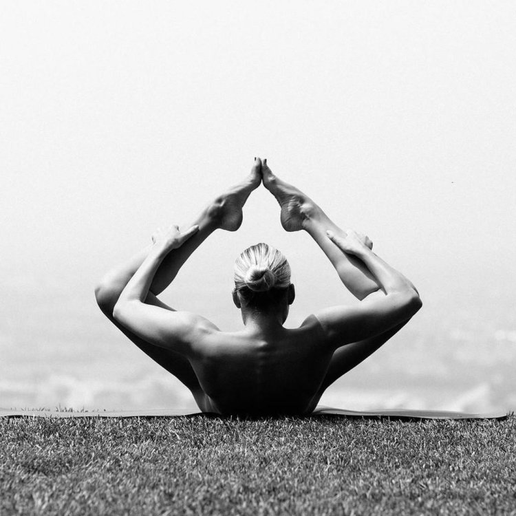 Naked yoga on the seashore