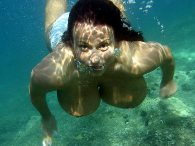 Women's swimming with big tits