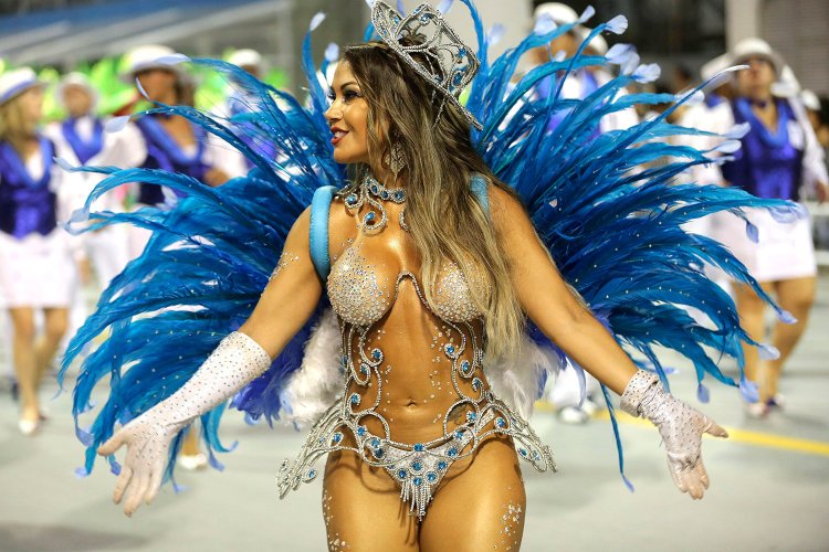 Naked women in carnival costumes