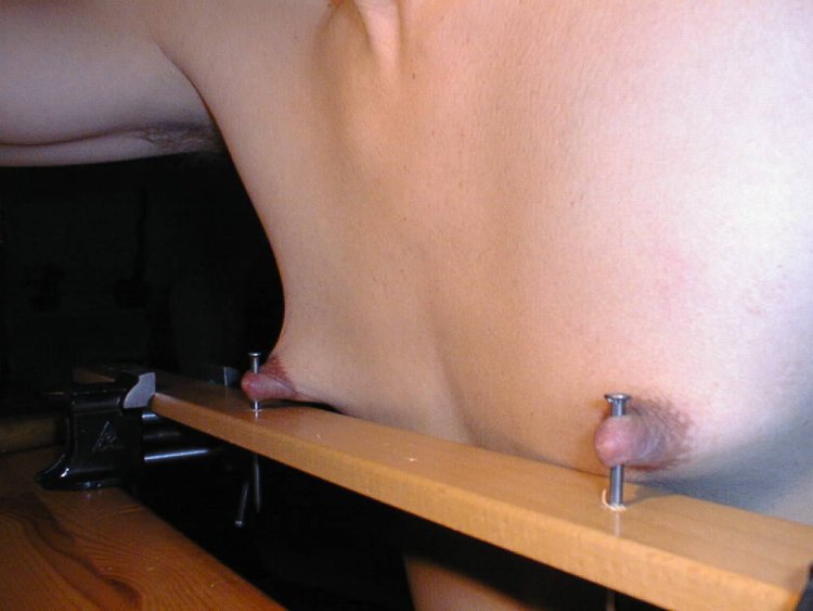Piercing the nipples of BDSM
