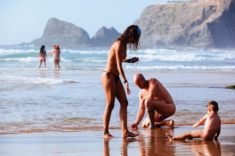 Naked women and men in nature