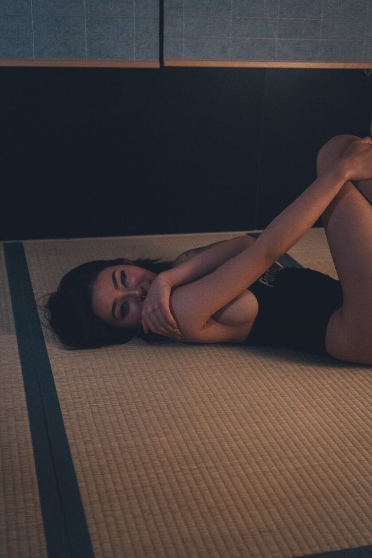 Rae Lil Black in a blue dress