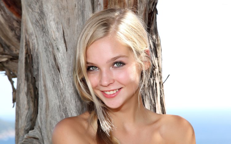 Photoshoot in the field in a long dress