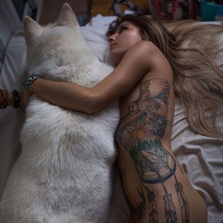 Tattooed girl with a dog