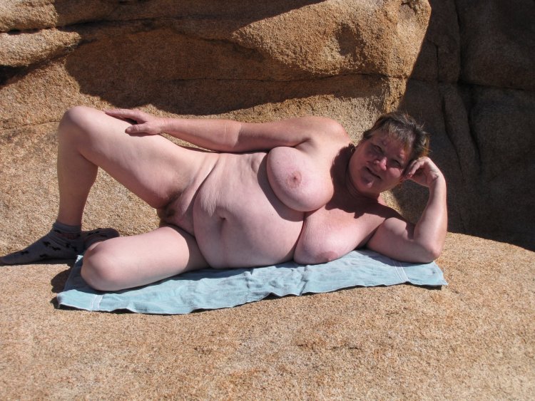 Old naked fat on the beach