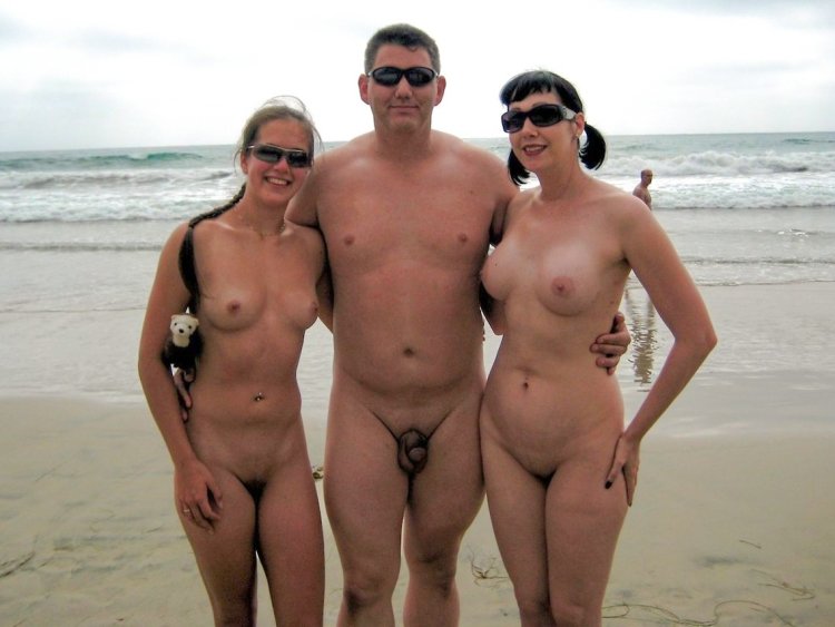 Piercing Naked family on the beach