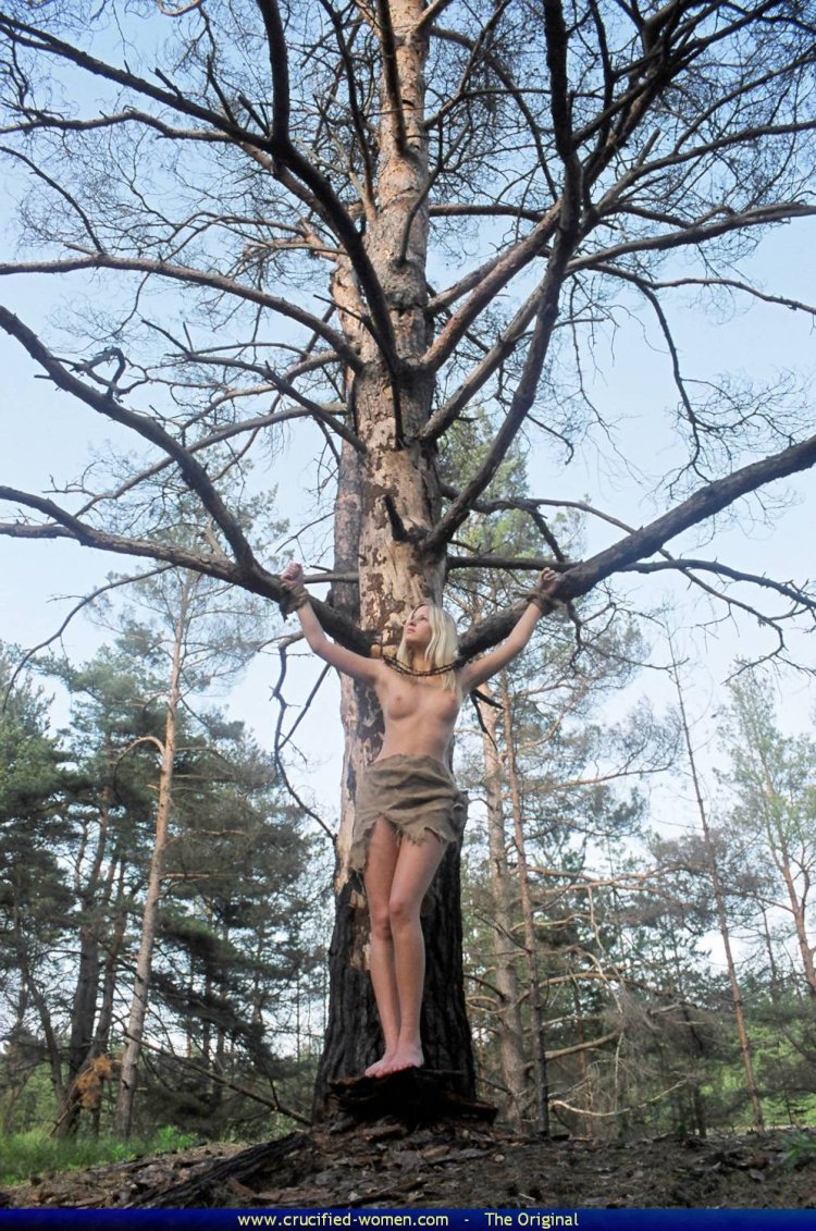 Naked crucified on the table