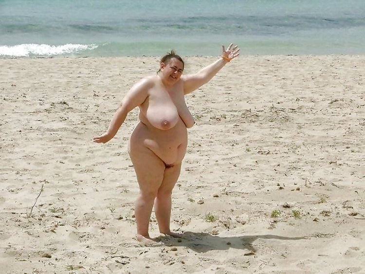 Young fat people on the beach