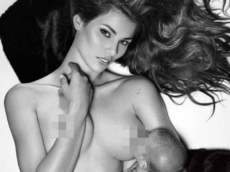 A decent girl poses topless