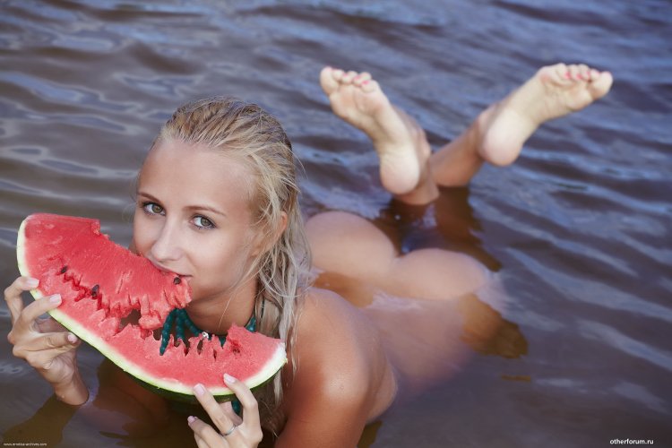 Naked woman with dick in watermelon