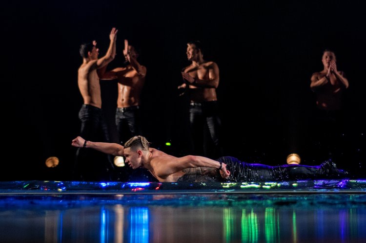 Naked dancers on a pylon