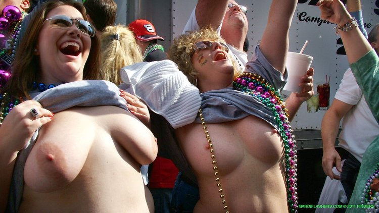 The girl showed her breasts on the parade