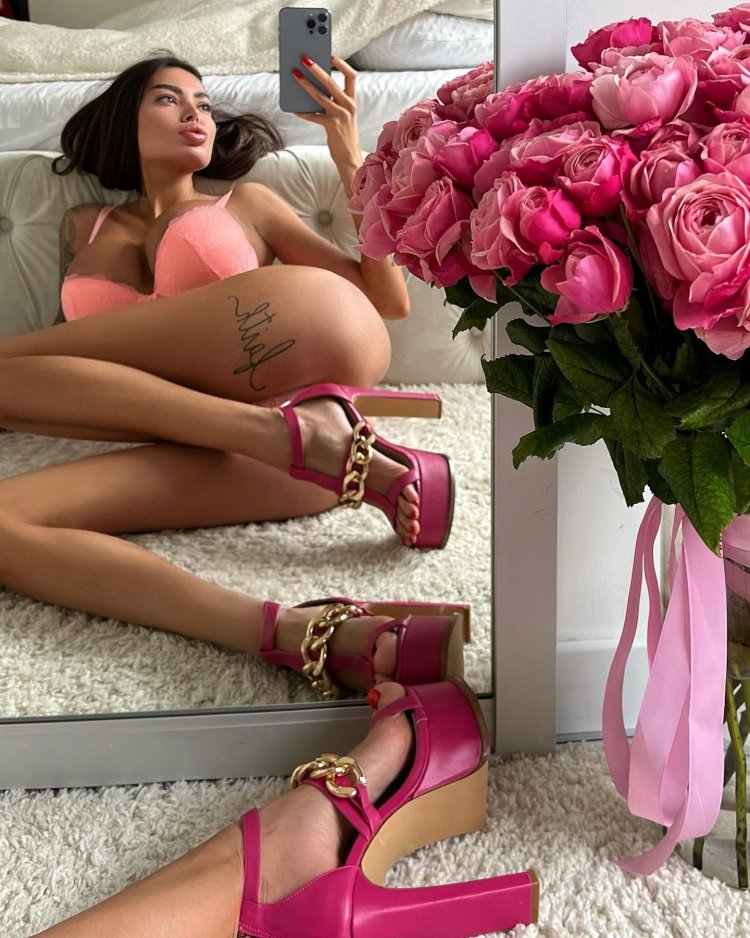 Alena Omovich in a dress