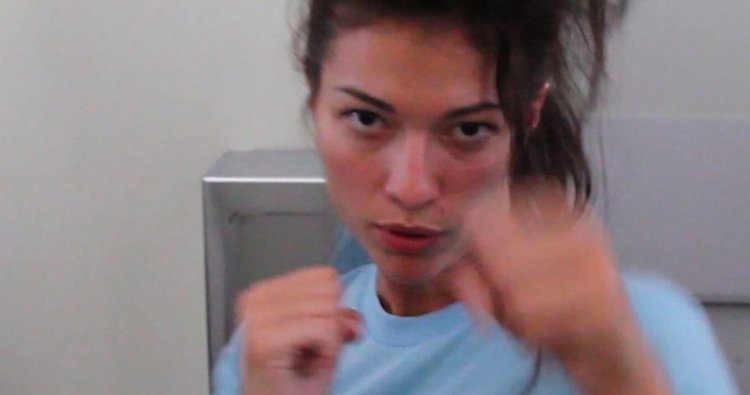 Woman in a yellow swimsuit on the beach