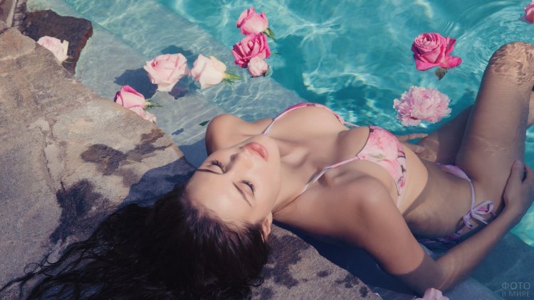 Girl in a swimsuit with flowers
