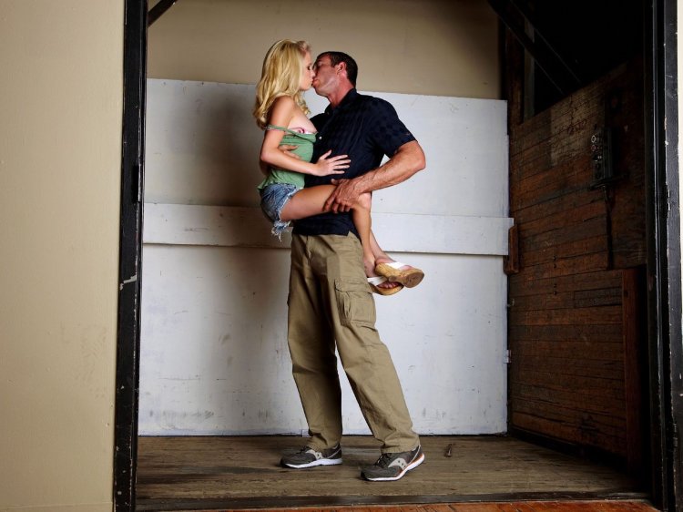 Naked man and woman in stockings standing