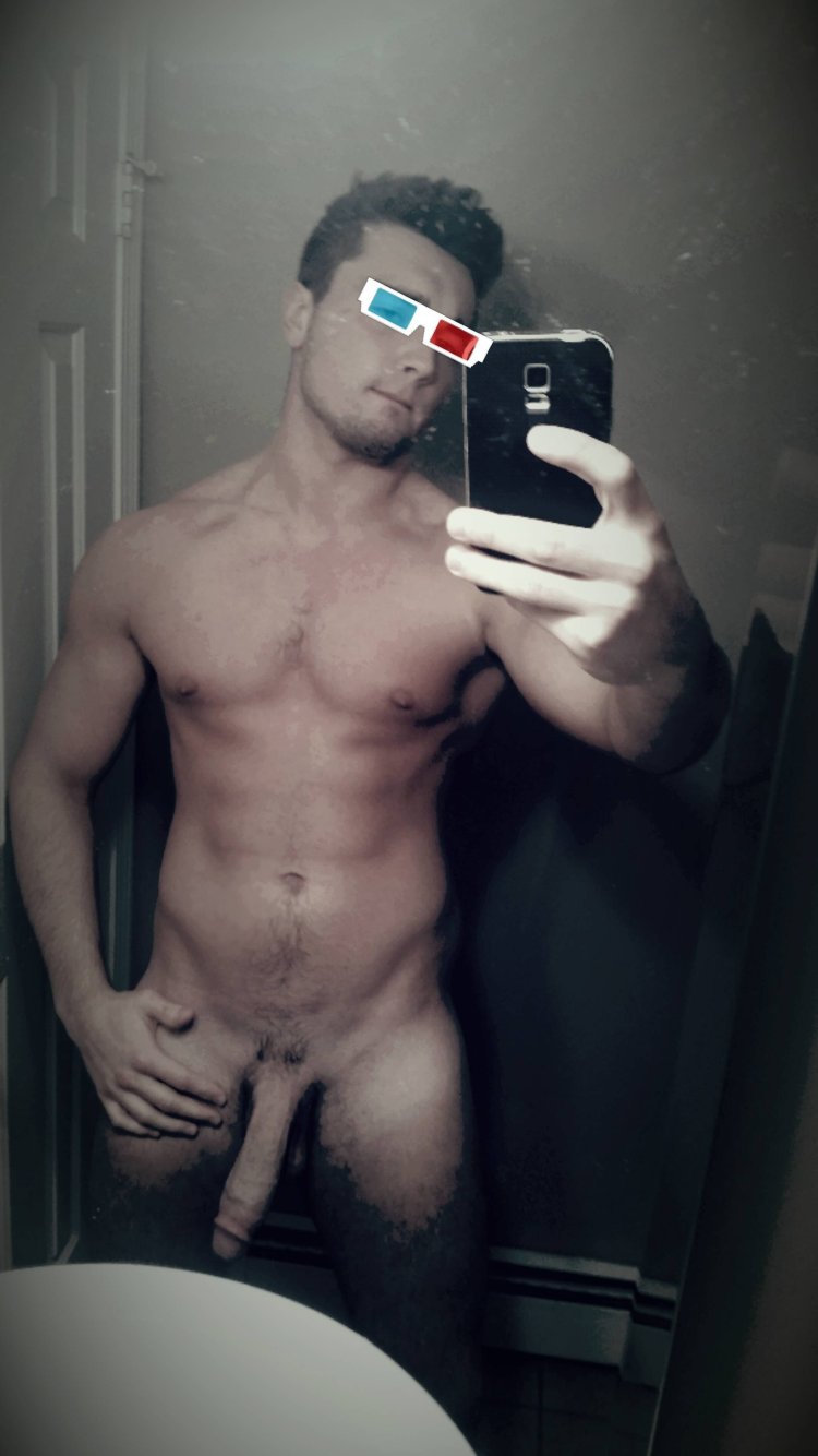 Naked guy in front of the mirror