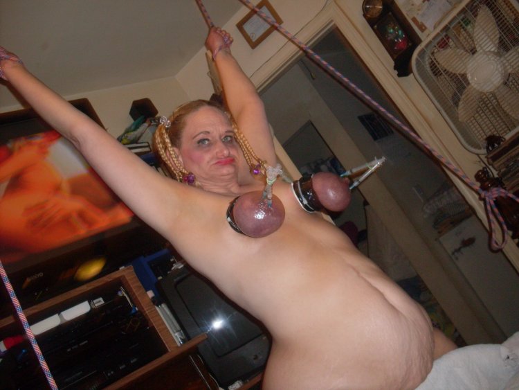 BDSM torture of a female breast