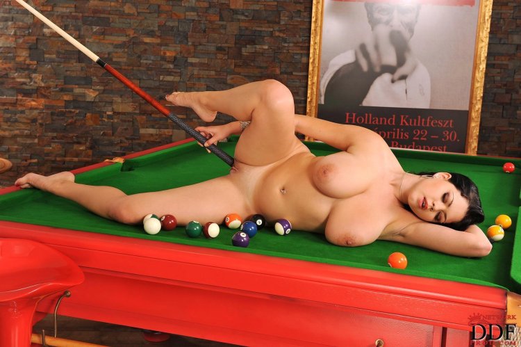 Naked women on a billiard table