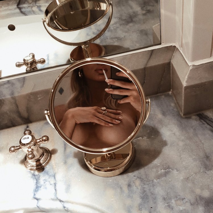 A man hugs a woman behind