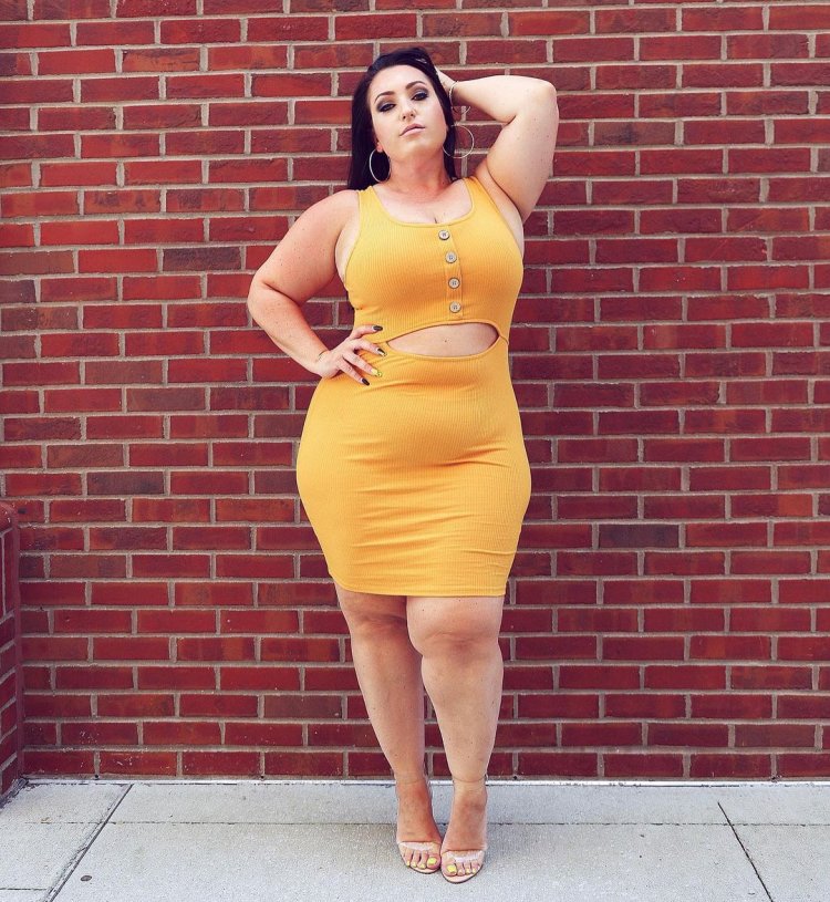 Amber Nova Curvage in a suit of super heroes