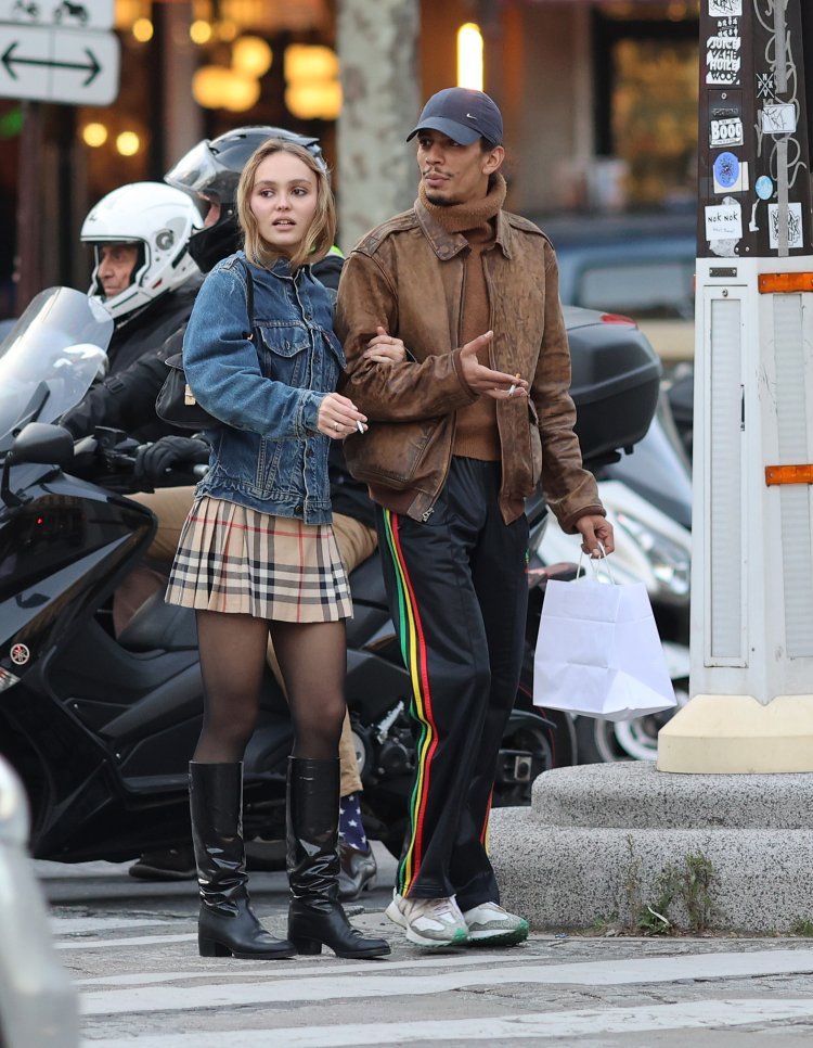 Lily Rose Depp in a black dress