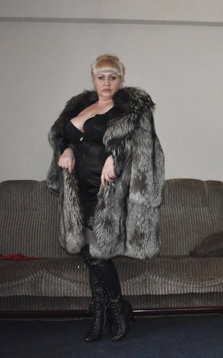 Old woman in a fur coat