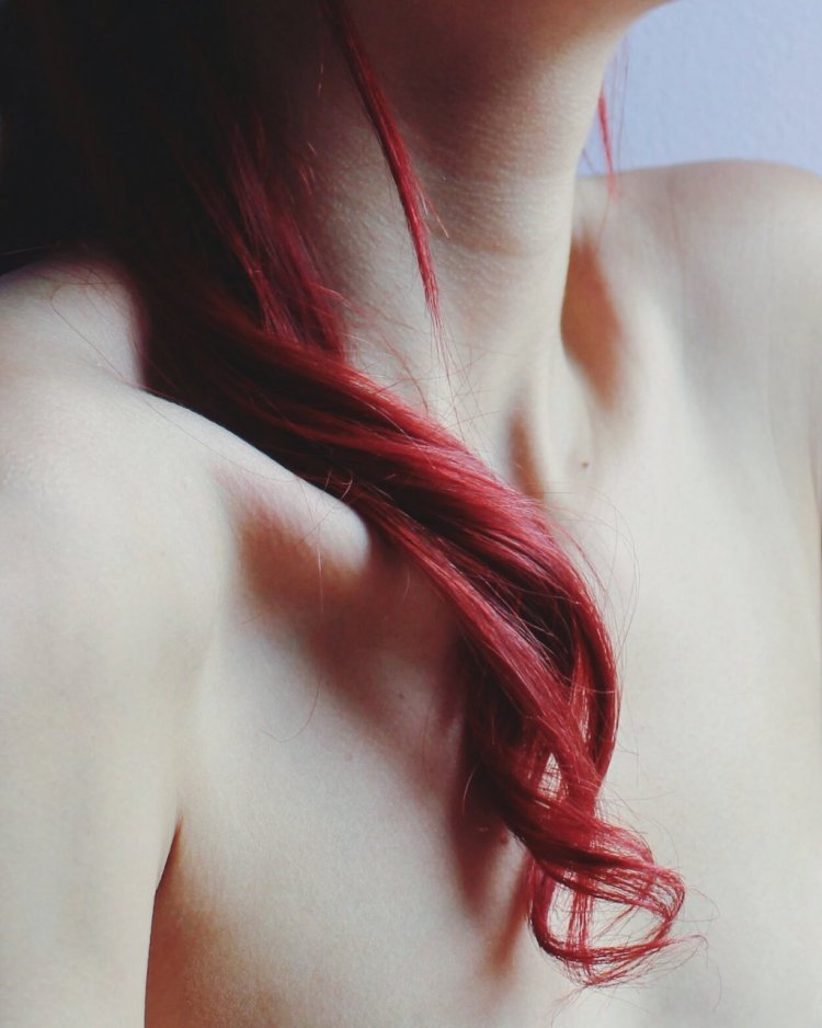 Girl with red hair without face