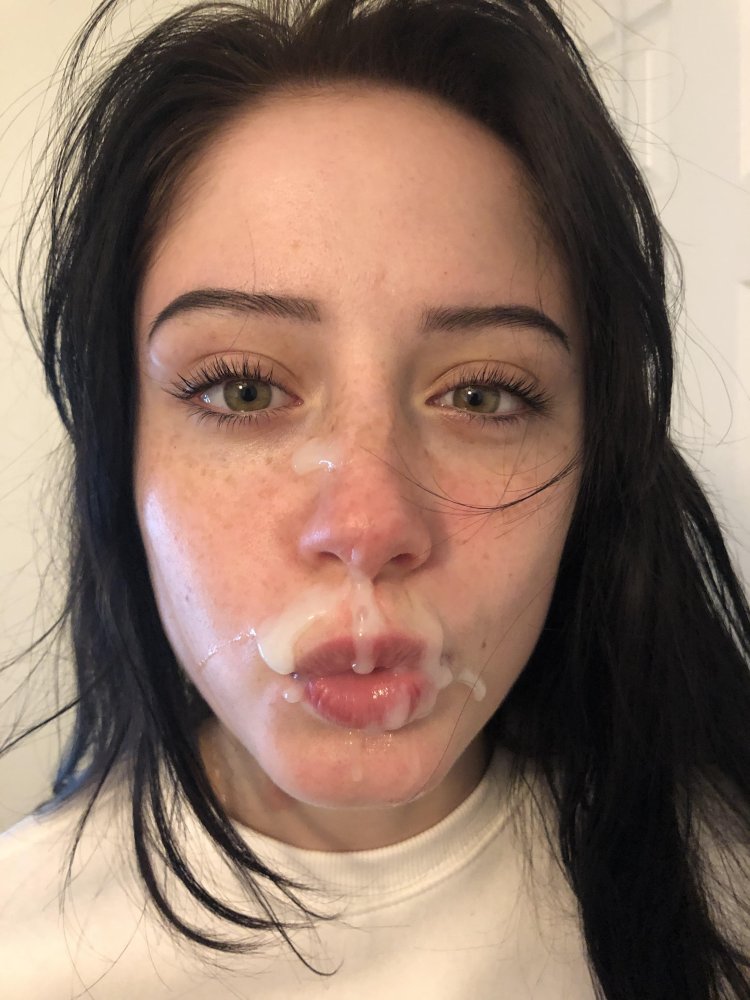 Girl in anticipation of a cumshot on her face