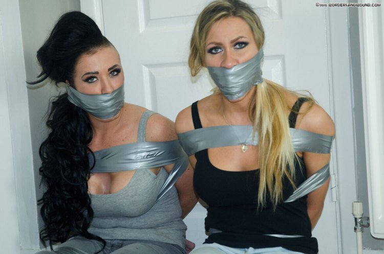 Naked girls connected by tape